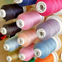 Sewing Thread Aesthetic_ 100% cotton thread arranged on a rack Sewing Thread Aesthetic_ 100% cotton thread arranged on a rack